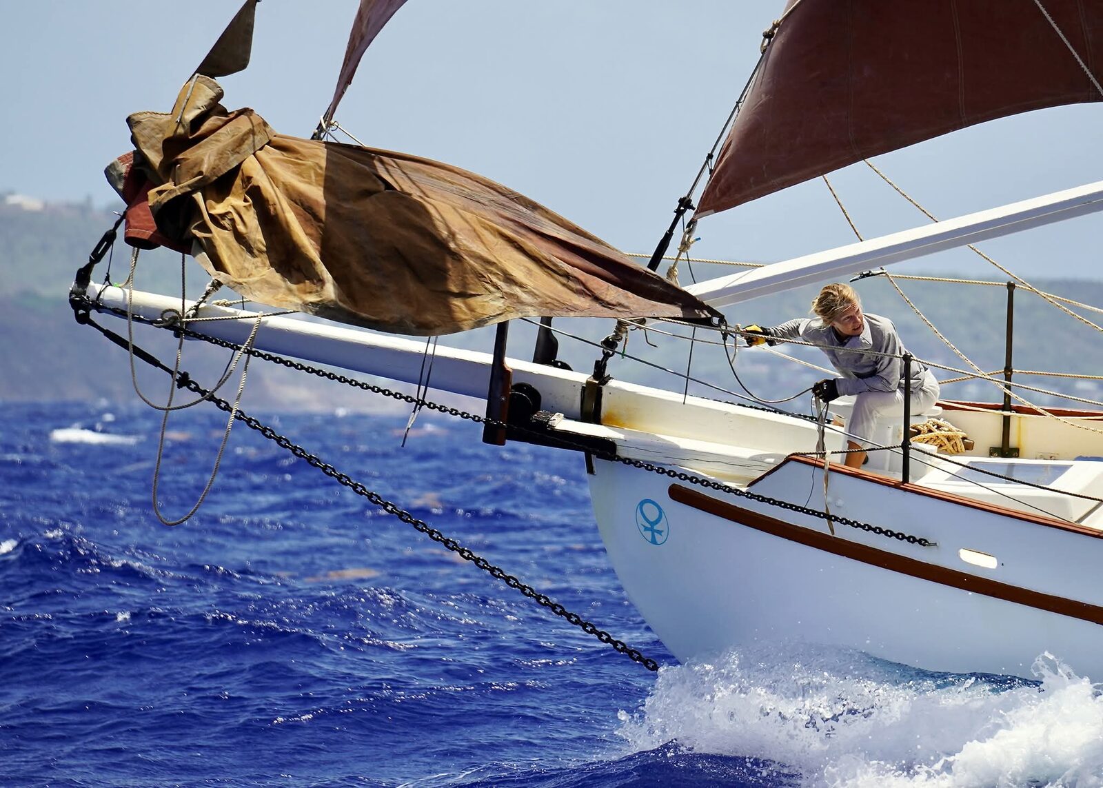 Cherub's varnished bowsprit and traditional rig detail